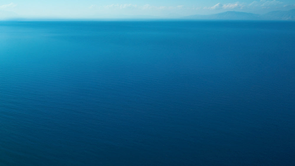 Aerial view of a clean Pacific Ocean, symbolizing successful ocean cleanup and environmental restoration