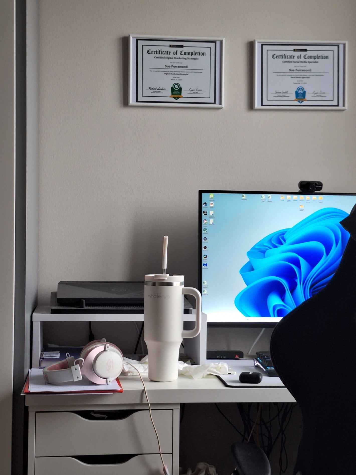 White Whalecup tumbler on home office desk setup with headphones and computer – sustainable hydration during productive workday