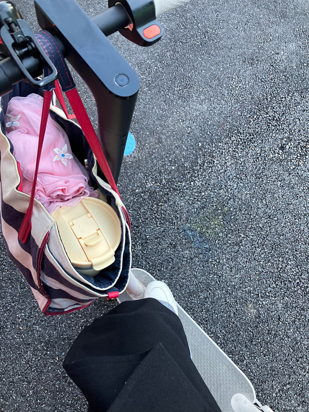 Whalecup tumbler placed in striped tote bag on stroller, perfect for moms and daily commutes – eco-friendly coffee on-the-go